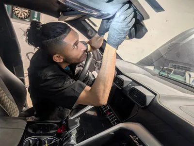 A Stealth mechanic recalibrating the car dash camera