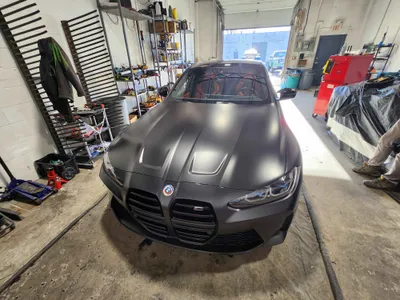 A BMW M4 Coupe ready for repairs at the Stealth garage
