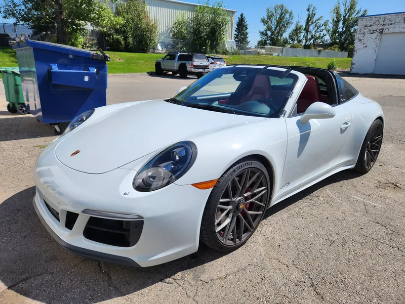 White Porsche Cayman after windshield replacement at Stealth garage