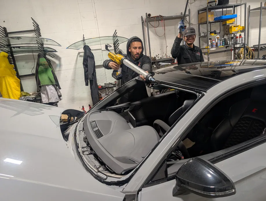 Windshield replacement at a Stealth garage by two of our Stealth technicians